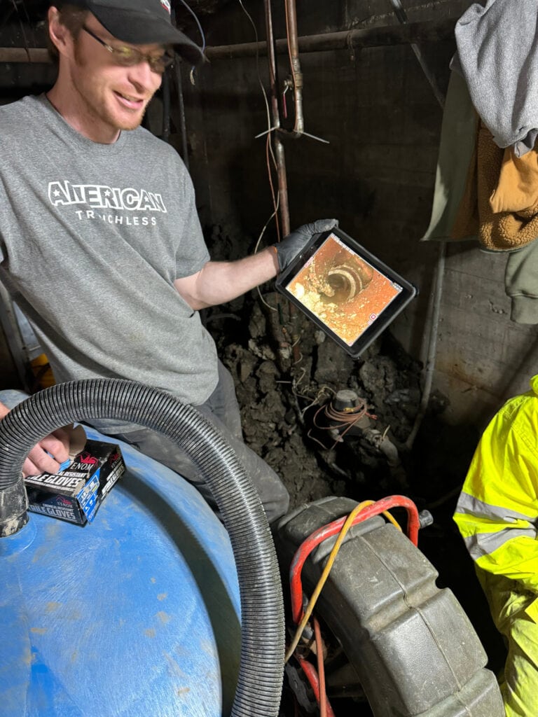 On-site camera review confirming the offset location before repair.