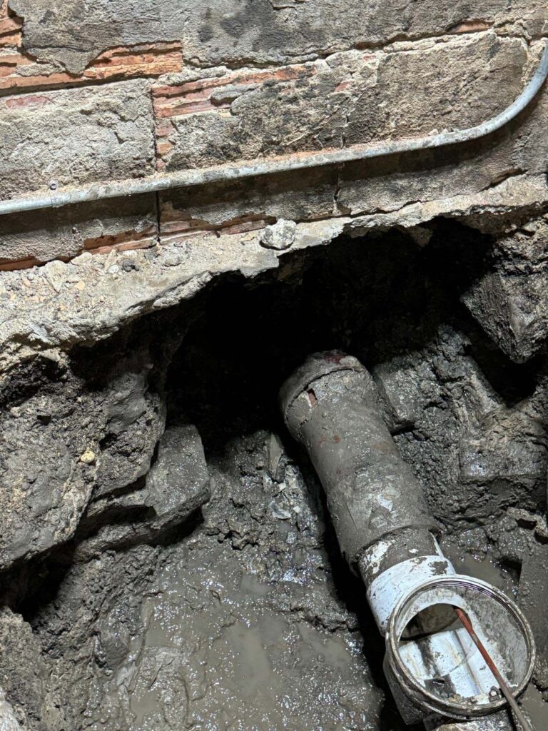 Exposed pipe section prior to lining and reinstatement.